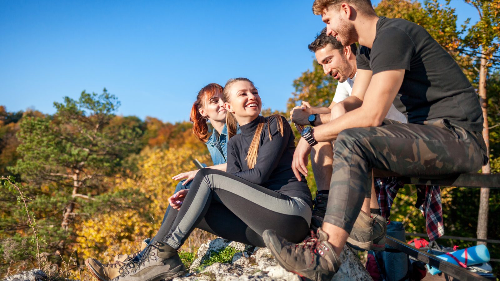 A group of walkers resting together on the trail